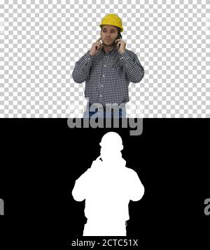 Construction worker using smartphone, Alpha Channel Stock Photo