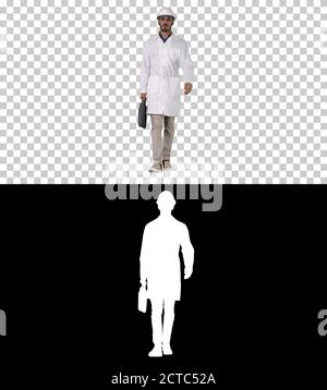 Professional engineer with suitcase and in helmet walking, Alpha Stock Photo
