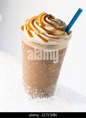 Iced caramel coffee covered with whipped cream Stock Photo