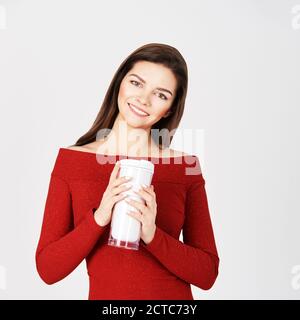 Beautiful girl with coffee tumbler. Takeaway drink cup. Student female. Reusable Stock Photo