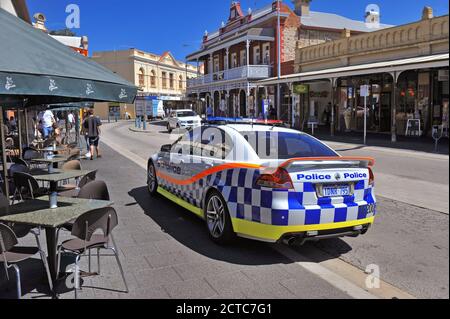 A Holden Police car, in Western Australian Police livery, in an urban environment. Stock Photo