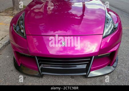 The front end of a customized magenta 2015 Nissan modified by the Japanese company Veilside. Parked on 162nd St. in Flushing, Queens, NYC Stock Photo