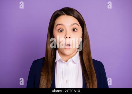 Close-up portrait of her she nice attractive pretty wondered brainy long-haired schoolchild learner got scholarship news grimace isolated over violet Stock Photo