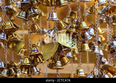 Gold and silver coloured bells decorate the Wat Phra Singh temple in Chiang Mai, Thailand. Stock Photo