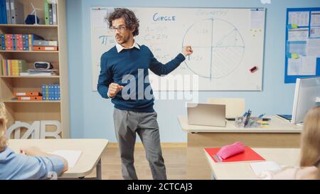 Portrait of Teacher Explaining Lesson to Classroom Full of Diverse Bright Children, In Elementary School Group of Smart Multiethnic Kids Learning Stock Photo