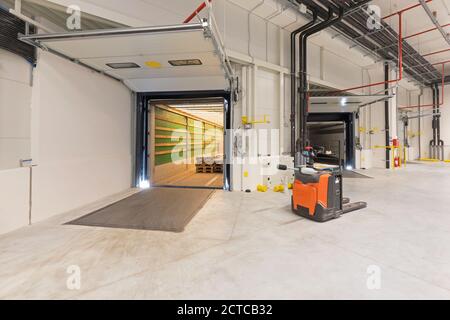 Truck Trailer at Loading Bay Pallet Jack Warehouse Stock Photo