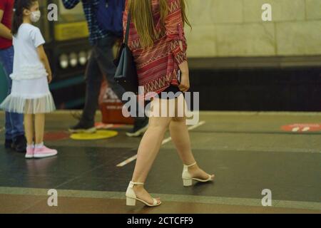 Moscow, Russia - July 6, 2020: Moscow subway station in the summer time. People wearing protective masks. Stock Photo