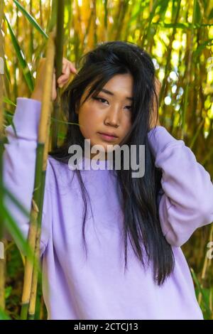 Outdoor portrait of a beautiful Chinese Asian young woman or girl with ...