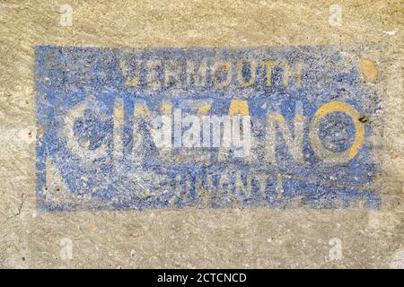 Close-up of an old, faded sign of the Cinzano alcohol industry on the weathered wall of a building in the centre of Courmayeur, Aosta Valley, Italy Stock Photo