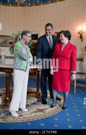 President Barack Obama visits with Supreme Court Justice Ruth Bader Ginsburg and newly confirmed Supreme Court Justice Elena Kagan in the Blue Room of the White House, prior to Kagan's confirmation reception in the East Room, Aug. 6, 2010. Stock Photo