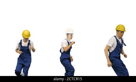 Three male construction workers in hard hats dancing in free sty Stock Photo