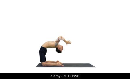 Yogi doing camel yoga pose on white background. Stock Photo
