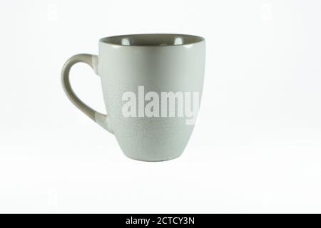 Mug with cracked walls on a white background in isolation Stock Photo