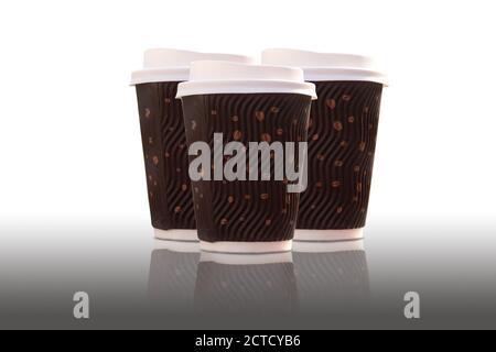 Three disposable coffee glasses with a lid on a white background Stock Photo