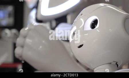 Humanoid robot dance. Dancing robot performance. Stock Photo