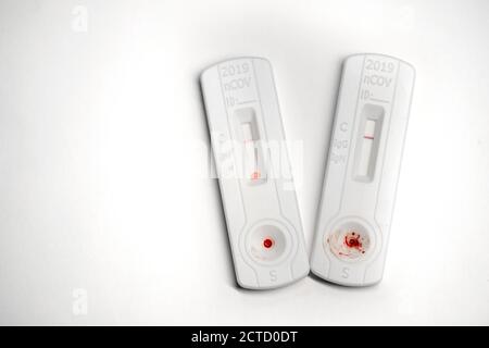 Negative test result by using rapid test device for COVID-19 with blood sample. Shot against white background with copy space available Stock Photo