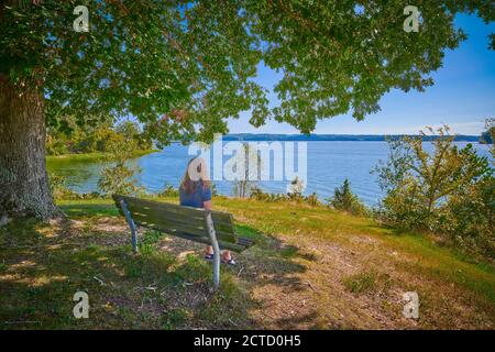 Women sitting on a bench enjoying the scenery of Kentucky Lake. Stock Photo