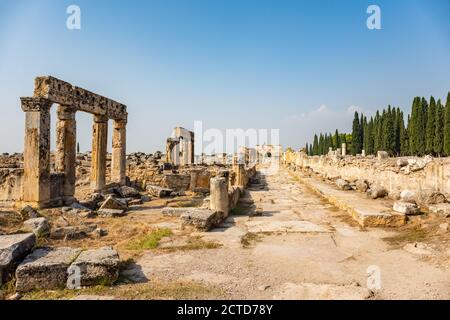 Hierapolis ancient city Pamukkale Turkey, young woman with hat watching ...