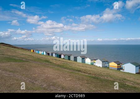 A row of colourful beach huts along the sea front in Tankerton, Whitstable. Stock Photo