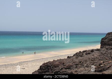 A group of tourists on the Mal Nombre beach, on the Canary Island of Fuerteventura, enjoy their holidays in July 2020. /ANA BORNAY Stock Photo