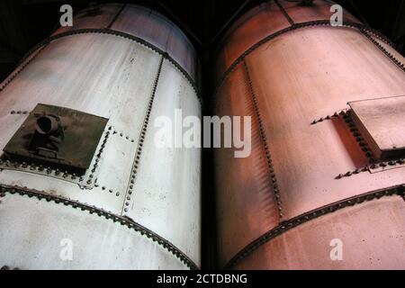 View of industrial tanks at old, closed electric power plant in Southern California. Stock Photo