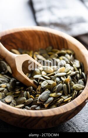 Download Peeled Pumpkin Seeds In A Wooden Bowl Stock Photo Alamy Yellowimages Mockups