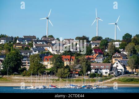 The Möhnesee, reservoir in the northern Sauerland, the village Delecke, on the northern shore, wind power plants, wind farm, NRW, Germany Stock Photo