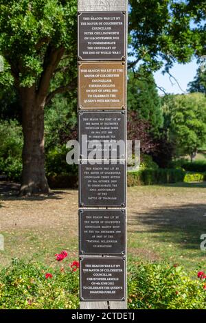 Beacon post plaques, first lit in 1988, in the grounds of Colchester Castle,  Castle Park, Colchester, Essex, UK. Stock Photo