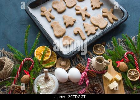 Step by step Christmas cookie recipe. Step four. Spread the cookies on a baking sheet and bake. Stock Photo
