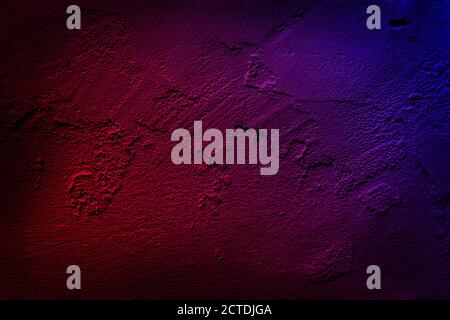 Neon light on cement walls plastered surface background and texture pattern. Lighting effect red and blue neon background of empty concrete wall. Stock Photo