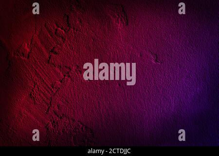 Neon light on cement walls plastered surface background and texture pattern. Lighting effect red and blue neon background of empty concrete wall. Stock Photo