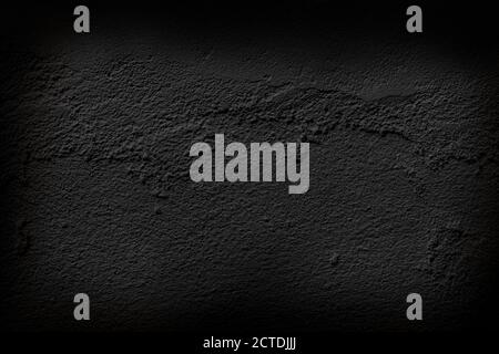 Beautiful black cement wall plastered surface background and texture pattern. Blank concrete dark rough wall for background. Stock Photo