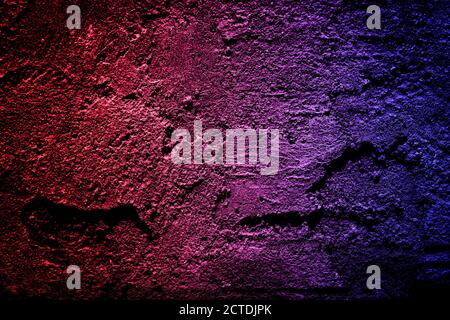 Neon light on cement walls plastered surface background and texture pattern. Lighting effect red and blue neon background of empty concrete wall. Stock Photo