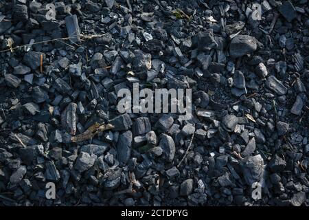 Black charcoal texture background. Close-up shot. Top view. Stock Photo