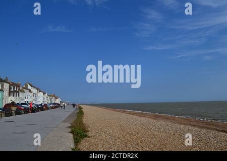 Long shingle beach at Deal, Kent looking north towards Thanet and Ramsgate. Colourful sea front attractive houses facing the English Channel Stock Photo