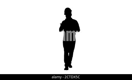Engineer walking and using smartphone, Alpha Channel Stock Photo
