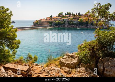 Sveti Stefan luxury resort. View to Sveti Stefan island in Adriatic sea from footpath. Stock Photo
