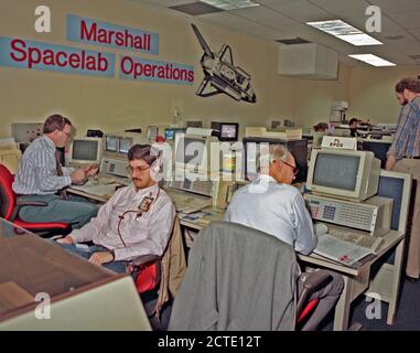 The Huntsville Operations Support Center (HOSC) Spacelab Payload Operations Control Center (SL POCC) at the Marshall Space Flight Center (MSFC) was the air/ground communication channel used between the astronauts and ground control teams during the Spacelab missions. Featured is the Spacelab Operations Support Room Space Engineering Support team in the SL POCC during STS-42, IML-1 mission. Stock Photo