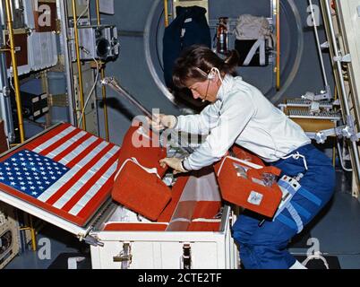 (25 June-9 July 1992) --- Astronaut Bonnie Dunbar, payload commander, unstows United States Microgravity Laboratory 1 (USML-1) experiment paraphernalia in early stages of the mission. Stock Photo