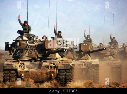 1977 - A convoy of M-60 main battle tanks move out during a training ...