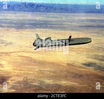 AN air-to-air side view of an AGM-86 air-launched cruise missile near ...