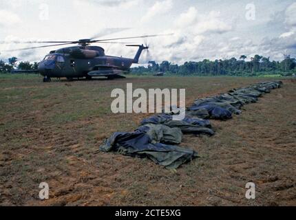 1978 - A US Air Force HH-53 Jolly Green Giant helicopter from the 55th Aerospace Rescue and Recovery Squadron stands by to assist in the removal of the remains of the victims of the Jonestown tragedy. Stock Photo