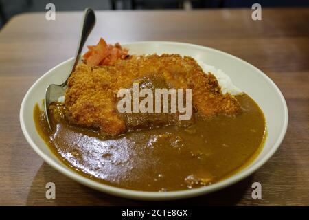 Top view of Japanese curry and Tonkutsu, Cutlet deep fried pork with Curry and rice. Stock Photo
