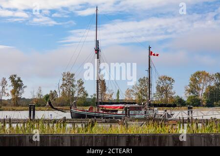 Sailing ship Providence docked beyond the flood barrier at the Britannia Ship Yard in Steveston British Columbia Canada Stock Photo