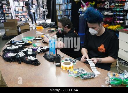 St. Louis, United States. 22nd Sep, 2020. Employees bag and price face masks for sale for Halloween, at Johnnie Brock's Dungeon Party Warehouse in St. Louis on Tuesday, September 22, 2020. The store is unsure that Halloween will occur in some places, so has invested in masks that are selling very well. Photo by Bill Greenblatt/UPI Credit: UPI/Alamy Live News Stock Photo