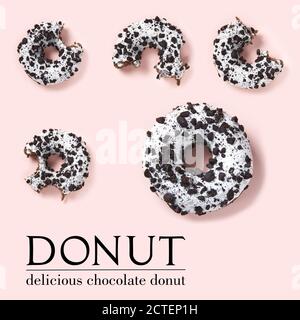 creative composition of donuts on a pink background. Flat lay delicious nibbled chocolate donuts and simple text. Stock Photo