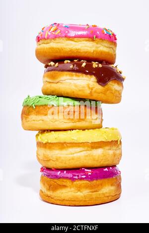 pile of glazed donuts isolated on white background Stock Photo - Alamy