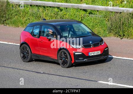 2019 red BMW I3S; Vehicular traffic moving vehicles, cars driving vehicle on UK roads, small motors, motoring on the M6 motorway highway network. Stock Photo