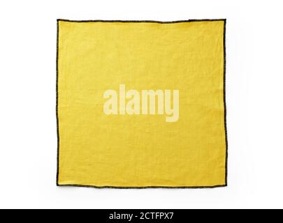 Flat lay with yellow linen kitchen napkin isolated on white background. Folded cloth for mockup with copy space Stock Photo