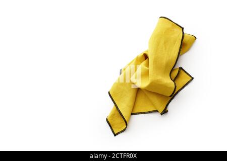 Flat lay with yellow linen kitchen napkin isolated on white background. Folded cloth for mockup with copy space Stock Photo
